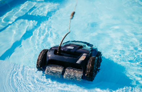 automatic pool cleaner removing debris from a residential swimming pool during maintenance