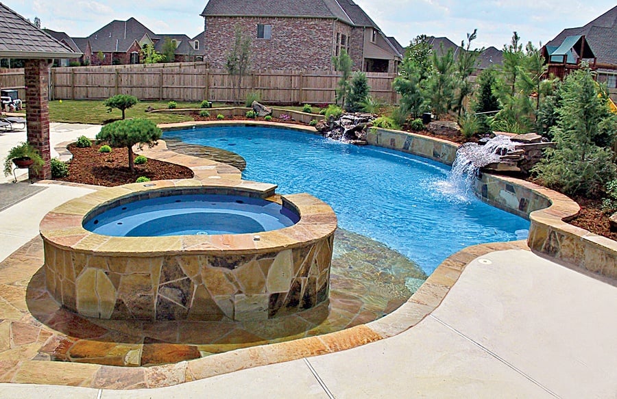 Beach entry pool with spa built by Blue Haven Pools Beach entry around custom spa