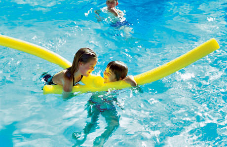 children playing in swimming pool children playing in swimming pool