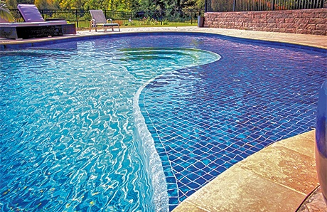 Custom Pool With Baja Shelf Covered in Blue Tile Custom Pool With Baja Shelf Covered in Blue Tile