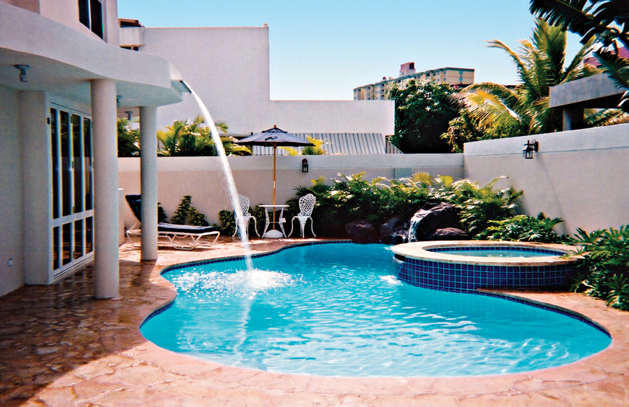 free-form-gunite-pool-with roof-mount-water-feature