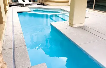 compact geometric pool designed for a narrow courtyard backyard space