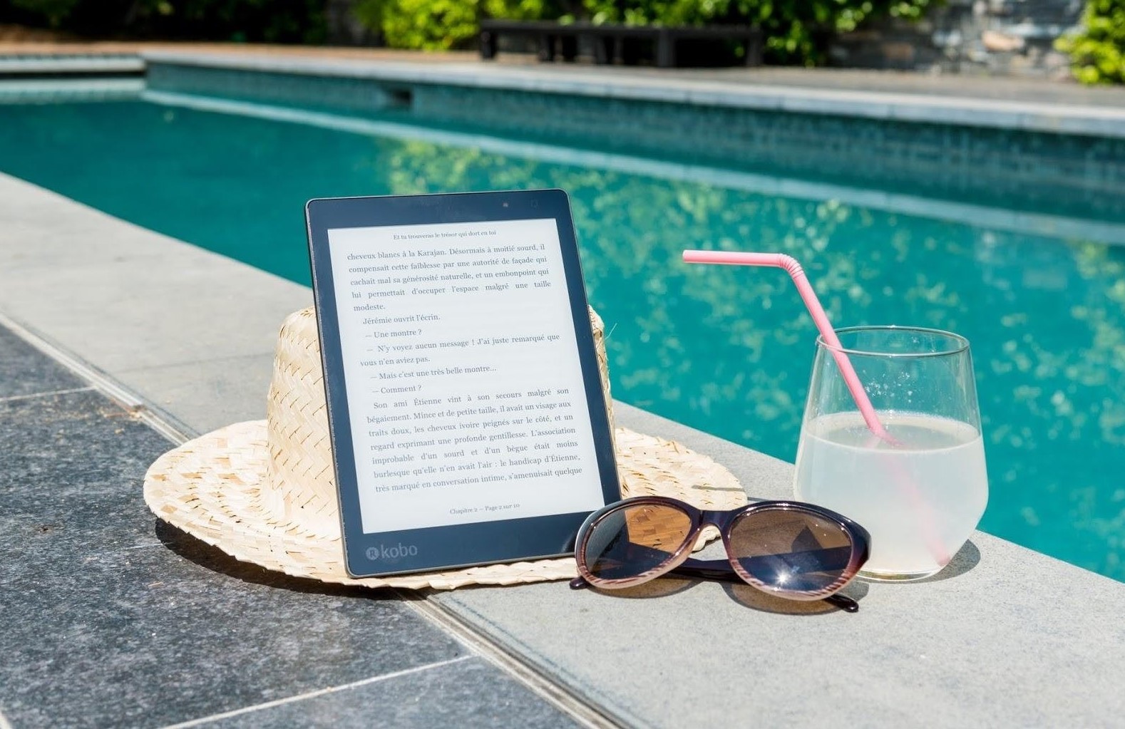 hat sunglass tablet poolside