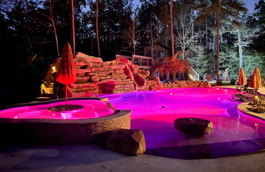 lagoon-style-pool-illuminated-in-pink-light