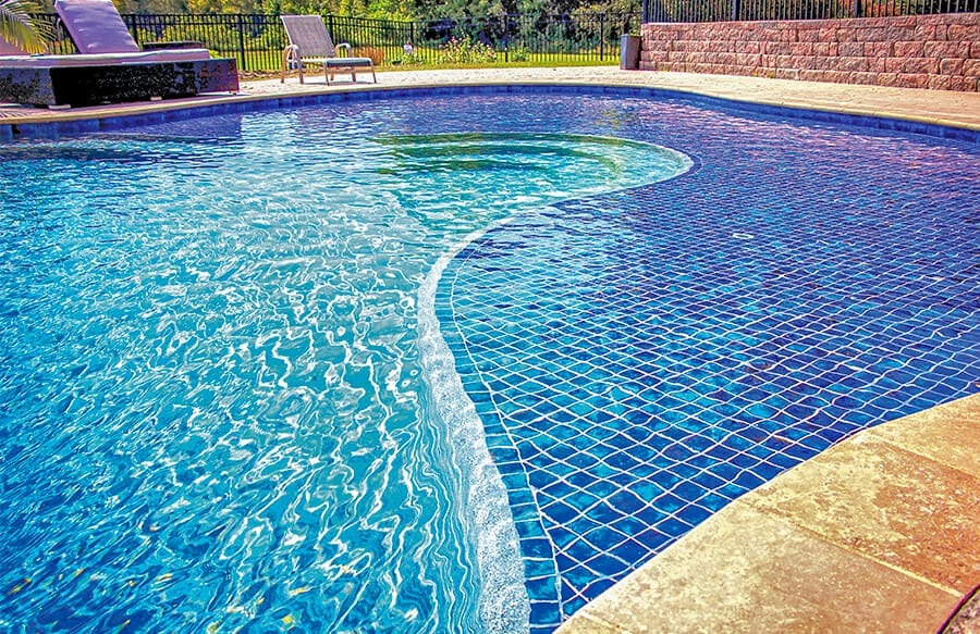 Pool sun shelf with full blue tile finish and defined ledge edge