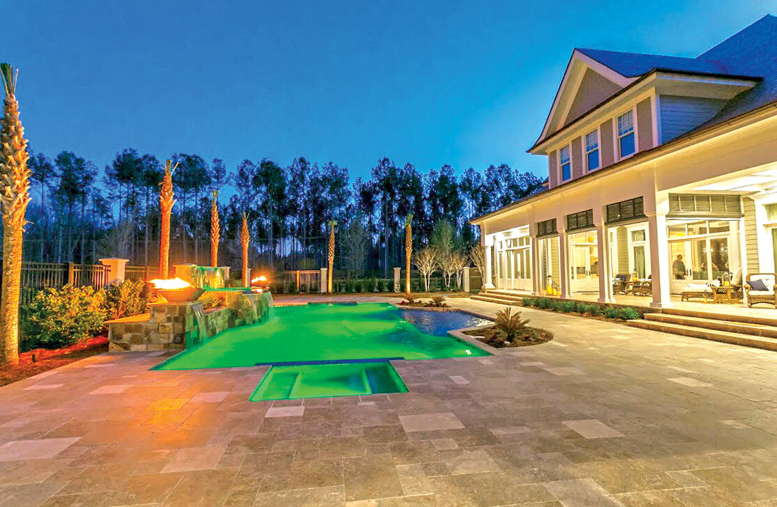rectangular pool with color changing LED lighting at night