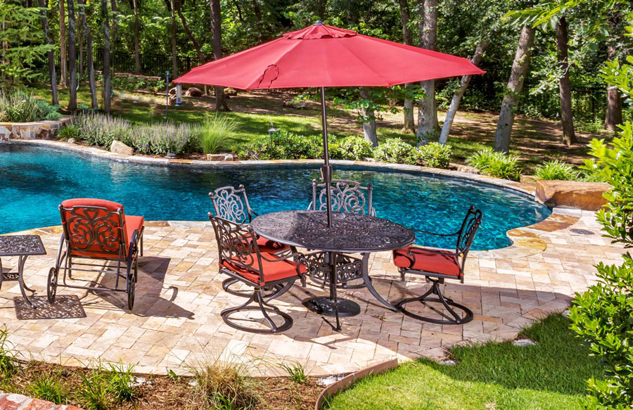 patio-set-by-swimming-pool