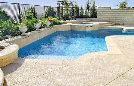 small backyard pool with partial deck layout and open landscaping on one side