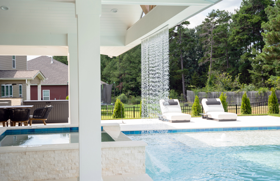 rain-curtain-on-roof-beam-over-square-spa
