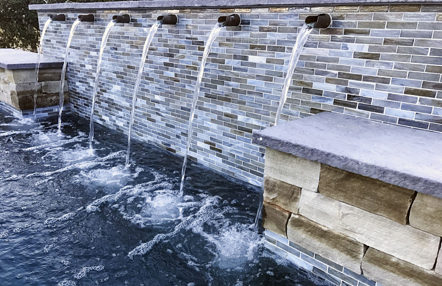 spouts-on-tiled-wall-on-pool