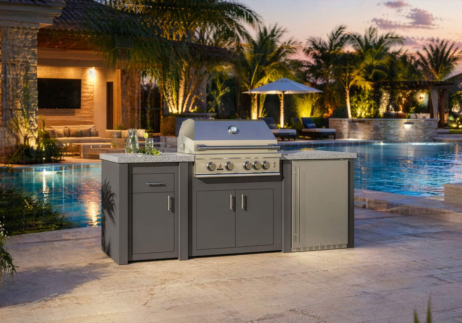 STONO 92-inch Solara outdoor kitchen island with charcoal base next to an illuminated pool at night
