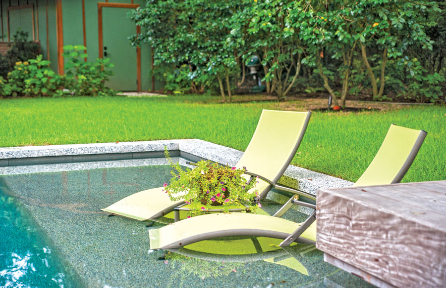 yellow-chaise-lounges-on-pool-tanning-ledge